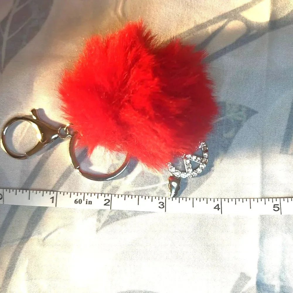 Purse Charm with Peace Sign with wings and Red Pom Pom. Purse Charm w/Key Ring